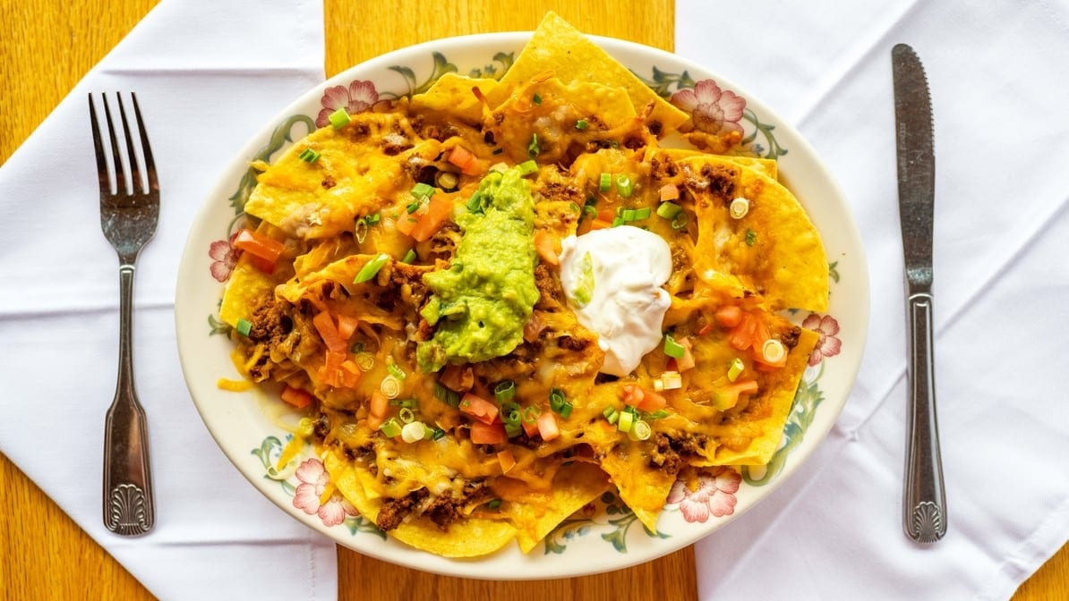 2. Nachos with Carnitas, Ground Beef, Chicken or Beans.